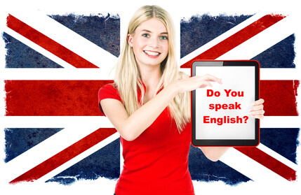 young woman holding tablet pc on the background with british national flag. english learning concept